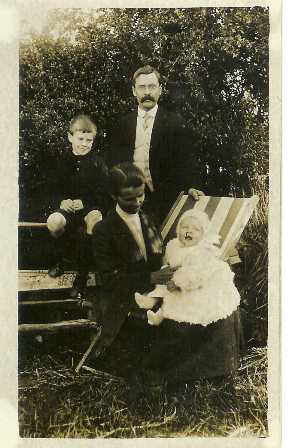 Arthur, Fred, Sadie and Frank in the garden of the company house in Hastings