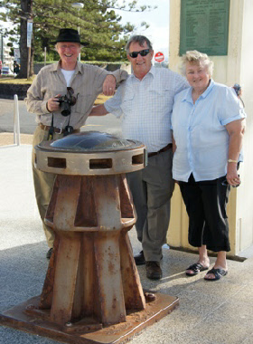 The end of a truly memorable day. Ewart with Ray and Denice Reese near the capstain of the Centaur on the border of Queensland and NSW. The memorial is also, or perhaps is primarily, a lighthouse.