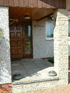 Front door with curling stones