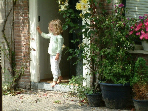 Little girl in her door