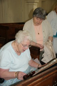 Enid Horton studies some of the documents.