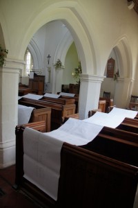 The shorter branches were draped over the pews.