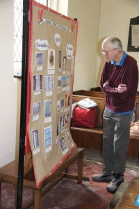 Bryan Inns studies the WW1 poster.