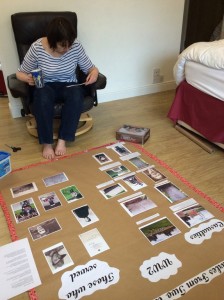 Elaine studies the stories of the people as she makes up the poster.